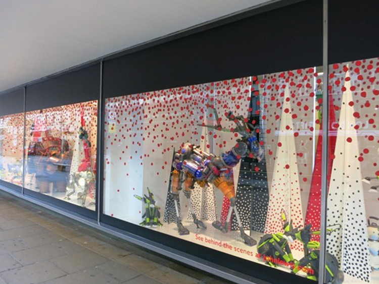 Cut vinyl graphics applied to window and window display elements