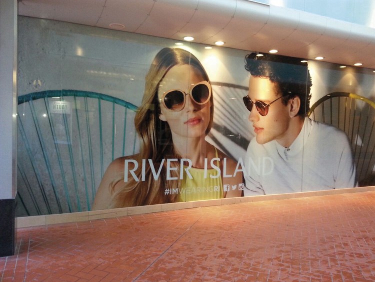 Large format window graphics are ideal for both short-term promotion and store branding