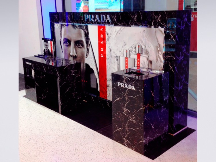 Chic, bespoke promotional site produced for Prada, featuring product plinths, counter display units and large lightbox graphics