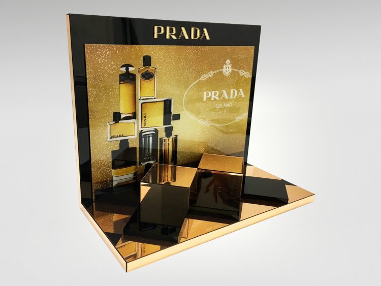 Colouration designed and produced this chic gold acrylic fragrance tester unit for Prada, a luxury display sure to enhance any cosmetics counter